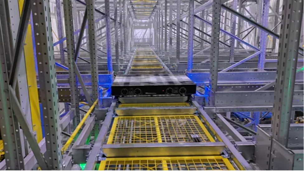 Four-way shuttles, lifts and safety doors inside the high-density warehouse