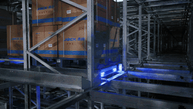 Four-way pallet shuttle for sewing machine finished goods